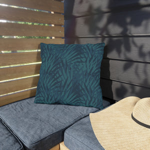 outdoor pillow with deep blue and teal tropical foliage