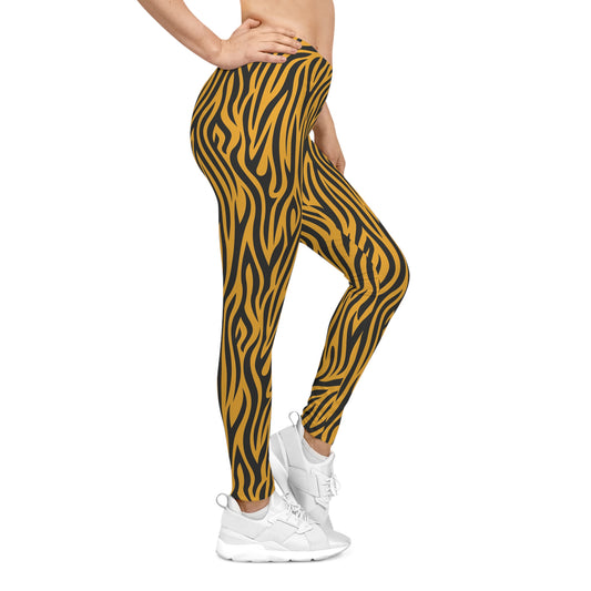 Right side view of casual leggings featuring a bold tiger stripe pattern with black wavy stripes on a vibrant orange background. The fabric has a smooth, silky texture.