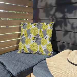 outdoor pillow with yellow and gray tropical leaf print