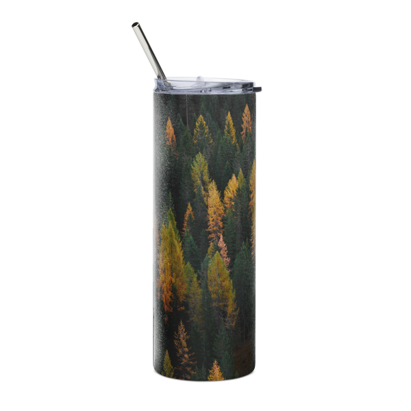 Tumbler with forest design and metal straw on a white background